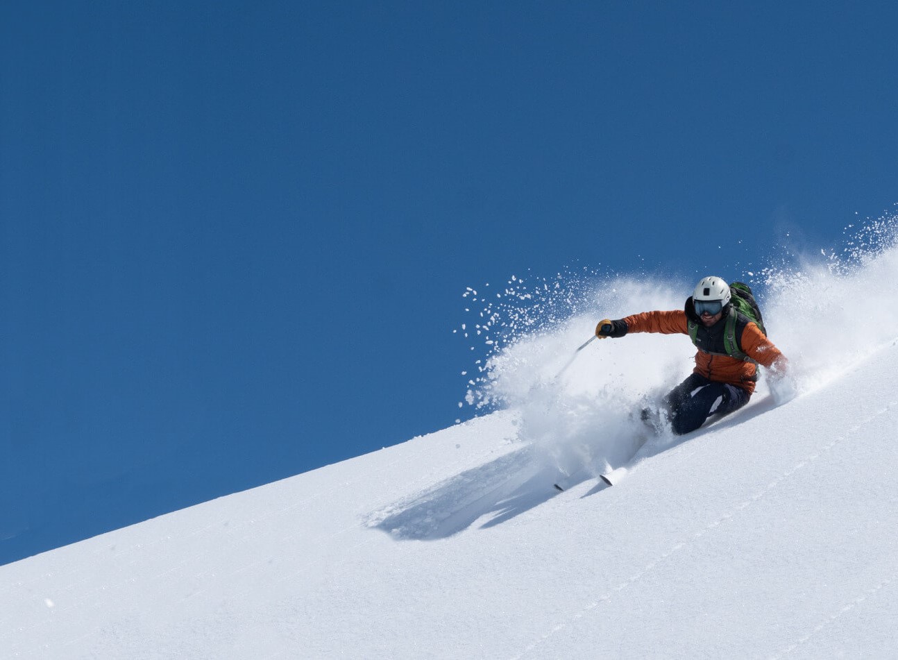 Ski instructor teaching in powder snow